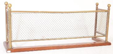 EDWARDIAN OAK PLINTH BRASS FENDER WITH WIREWORK DETAIL