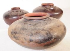 THREE EARLY 20TH CENTURY CHINESE BROWN EARTHENWARE POTS