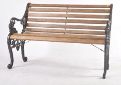 20TH CENTURY GARDEN CAST IRON AND TEAK BENCH