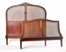EARLY 20TH CENTURY CARVED WALNUT & WICKER DOUBLE BED FRAME