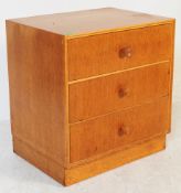 A MID CENTURY RETRO MEREDEW LIGHT OAK CHEST OF DRAWERS.