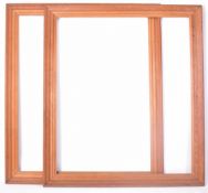 PAIR OF 20TH CENTURY CARVED PINE MIRROR FRAMES