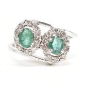 WHITE GOLD EMERALD & DIAMOND CROSSOVER RING