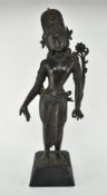 INDONESIAN BRONZE STANDING BUDDHA FIGURE ON A STAND