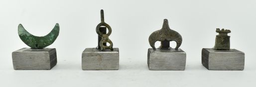 COLLECTION OF FOUR VIKING AND SIMILAR AMULETS / BROOCHES