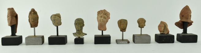 NINE ROMAN TERRACOTTA HUMAN HEADS