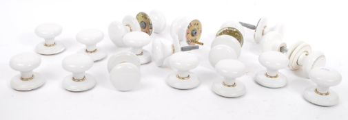 COLLECTION OF NINETEEN WHITE CERAMIC DOOR HANDLES