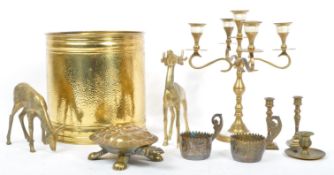 COLLECTION OF TEN MID CENTURY BRASS CANDLE / CANDELABRA ITEMS