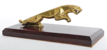 20TH CENTURY BRASS JAGUAR CAR BONNET ON PLINTH