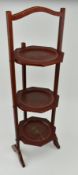 1920S CHINOISERIE RED LACQUERED THREE TIER SIDE TABLE