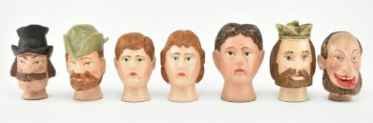 COLLECTION OF SEVEN BLACK FOREST CARVED PUPPET HEADS
