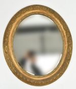 EARLY 20TH CENTURY OVAL GILT FRAMED MIRROR