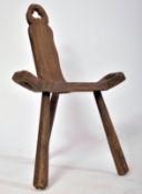 LATE 19TH CENTURY ELM BIRTHING BRUTALIST MILKING STOOL
