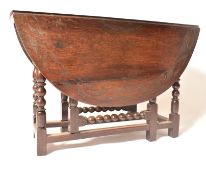 19TH CENTURY CARVED OAK GATE LEG TABLE