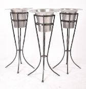 THREE CHROME & CAST IRON CHAMPAGNE BUCKETS & STANDS