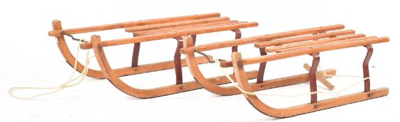 PAIR OF VINTAGE FESTIVE WOODEN & METAL SLEDS