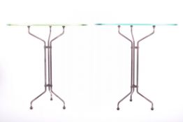 TWO MID CENTURY GLASS & WROUGHT IRON SHOP STAND TABLES