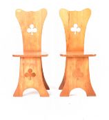 MATCHING PAIR OF CARVED PINE CLOVER CHAIRS