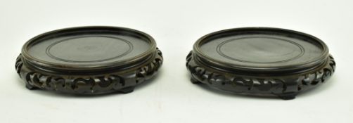 PAIR OF EARLY 20TH CENTURY CHINESE HARDWOOD VASE STANDS