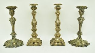 FOUR MID 19TH CENTURY VICTORIAN SILVER PLATED CANDLESTICKS