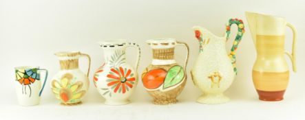 SIX 1930S & LATER CERAMIC JUGS - CLARICE CLIFF, CROWN DEVON ETC