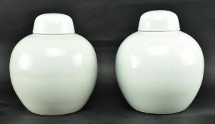 PAIR OF LATE 20TH CENTURY BLANC DE CHINE LIDDED URNS