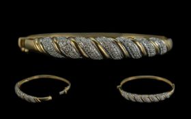 Ladies 9ct Gold Attractive Diamond Set Hinged Bangle. Full Hallmark to Interior of Bangle. Weight