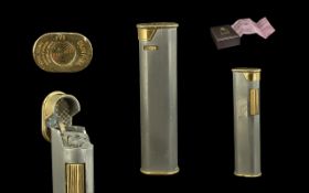 Dunhill Swiss Made Slimline Oval Gold Tone Gas Lighter, with box and papers. 3'' - 7.5 cm high. Good