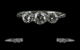 18ct White Gold and Platinum 3 Stone Diamond Set Ring. Marked 18ct and Platinum. The 3 Round