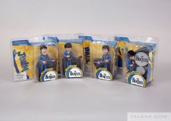 A complete set of all four McFarlane SPAWN.COM Beatles figures