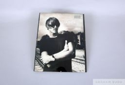 A large hand signed black and white Paul Weller image