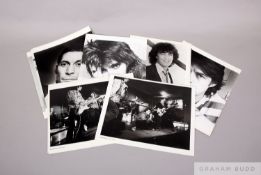 Eleven black and white promotional photographs of the Rolling Stones