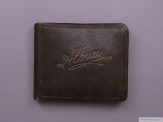 An 1930s cricket autograph book containing team and individual autographs