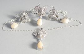 A THREE-PIECE SILVER AND REAL OPAL SET. Pendant, ring and earrings.