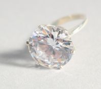 A SILVER LARGE CUBIC ZIRCONIA SOLITAIRE RING.