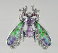 A SILVER AMETHYST BUG BROOCH.