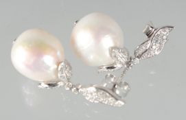 A PAIR OF SILVER BAROQUE PEARL EARRINGS.