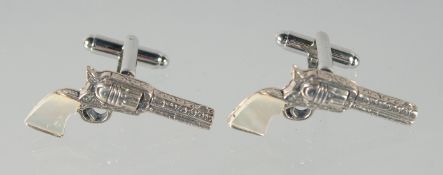 A PAIR OF SILVER AND MOTHER OF PEARL PISTOL CUFFLINKS
