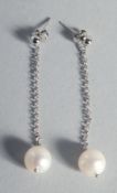 A PAIR OF SILVER AND PEARL LONG DROP EARRINGS.