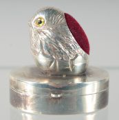 A SILVER CHICK OVAL PIN CUSHION AND BOX.