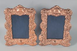 A PAIR OF COPPER PHOTOGRAPH FRAMES, 23 cm x 15 cm.