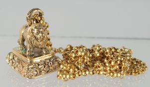 A GOLD PLATED SEAL AND CHAIN.