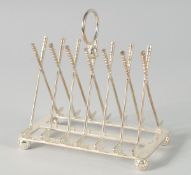 A SILVER PLATED CROSSED GOLF CLUBS TOAST RACK.