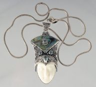 A SILVER AND ENAMEL ART DECO FACE NECKLACE.