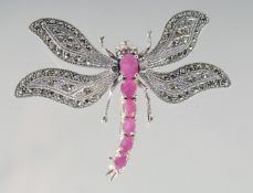 A SILVER RUBY SET DRAGONFLY BROOCH.
