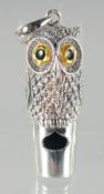 A SILVER OWL WHISTLE, 4 cm.