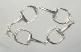 A SILVER HORSE STIRRUP BRACELET.