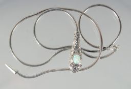A SILVER, OPAL, AND RUBY SNAKE NECKLACE.
