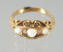 A SILVER AND 18ct. GOLD OPAL AND DIAMOND RING.