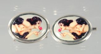 A PAIR OF SILVER CUFFLINKS.
